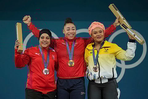 Paris Olympics women's 81kg weightlifting: Sara Ahmed of Egypt, silver, Solfrid Eila Amena Koanda of Norway, gold, and Neisi Patricia Dajomes Barrera of Ecuador, bronze